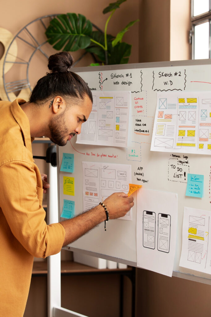 side-view-man-working-with-white-board